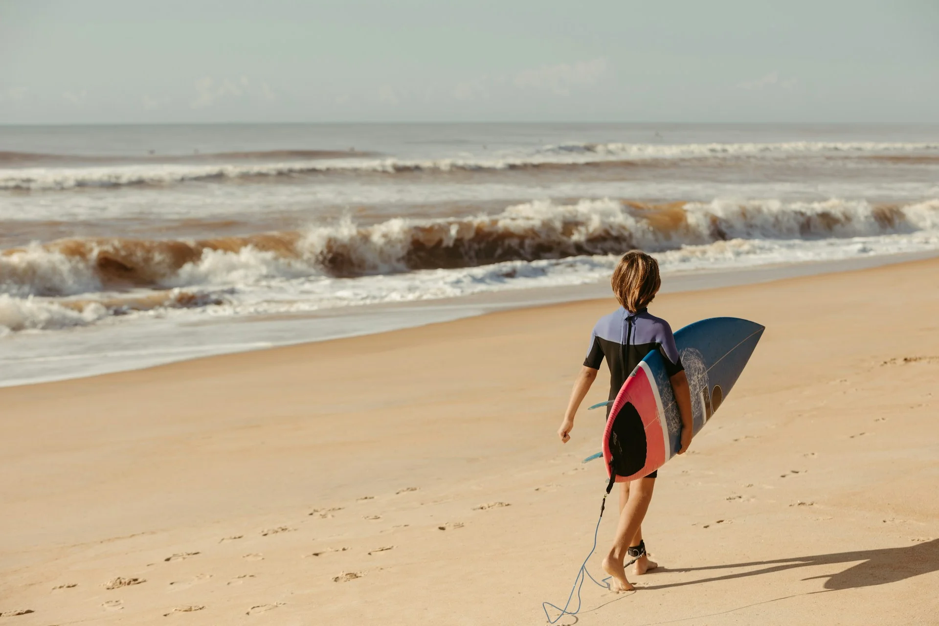 photo - a child is going to be surfing waikiki beach