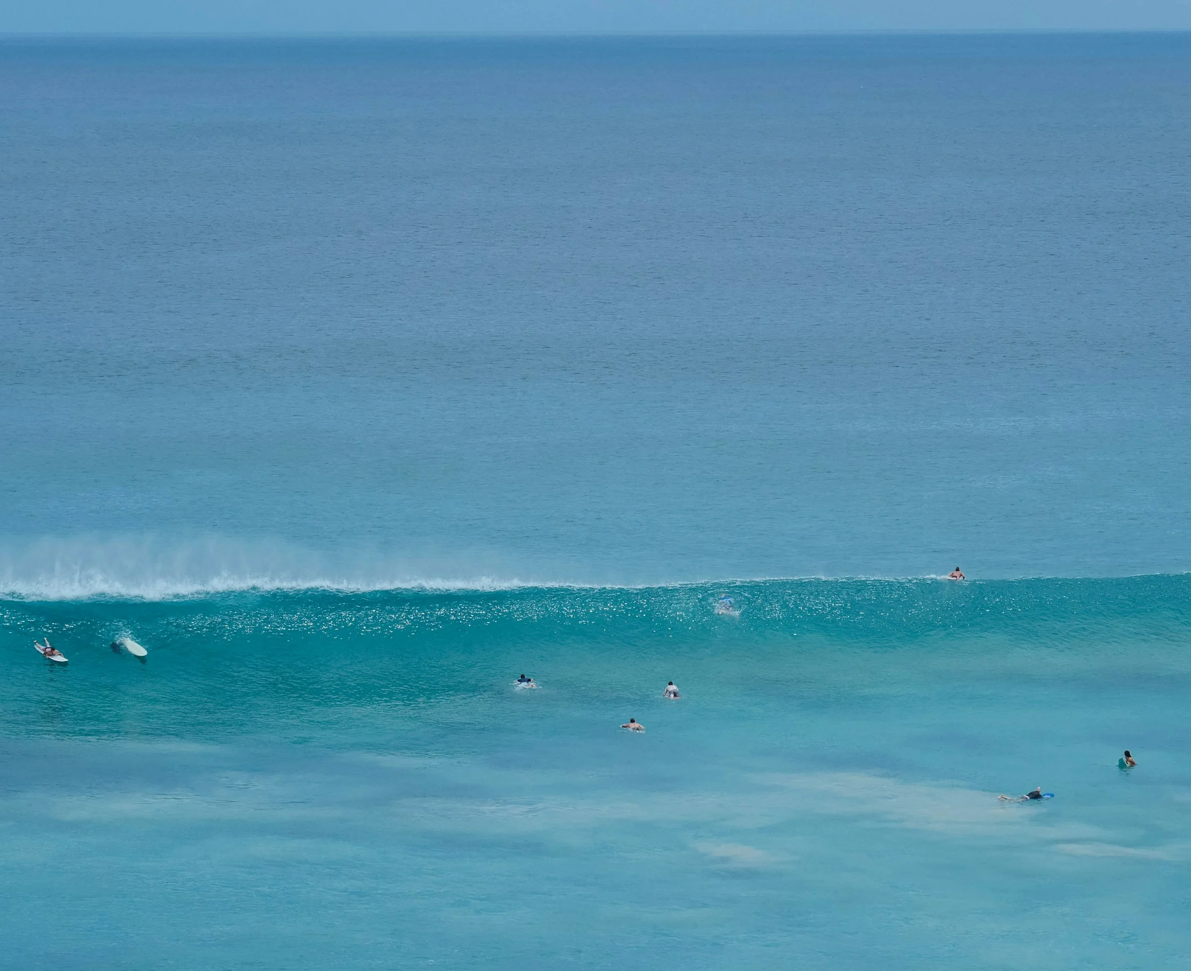 photo - beautiful blue ocean water with safe surfing waves