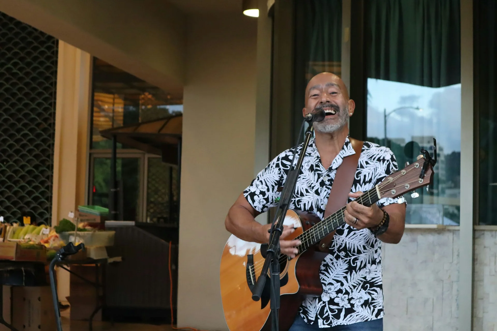 photo - a hawaiian man singing and teaching the listeners hawaiian greetings and phrases