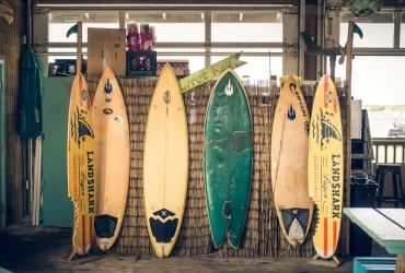 photo - different Surfboard Types stacked in a Hawaiian building