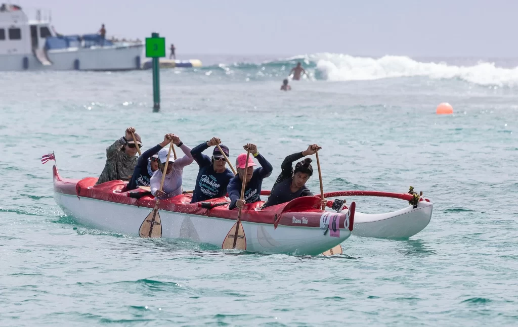 photo - people on hawaiian outrigger canoe showing people the best way to see hawaii