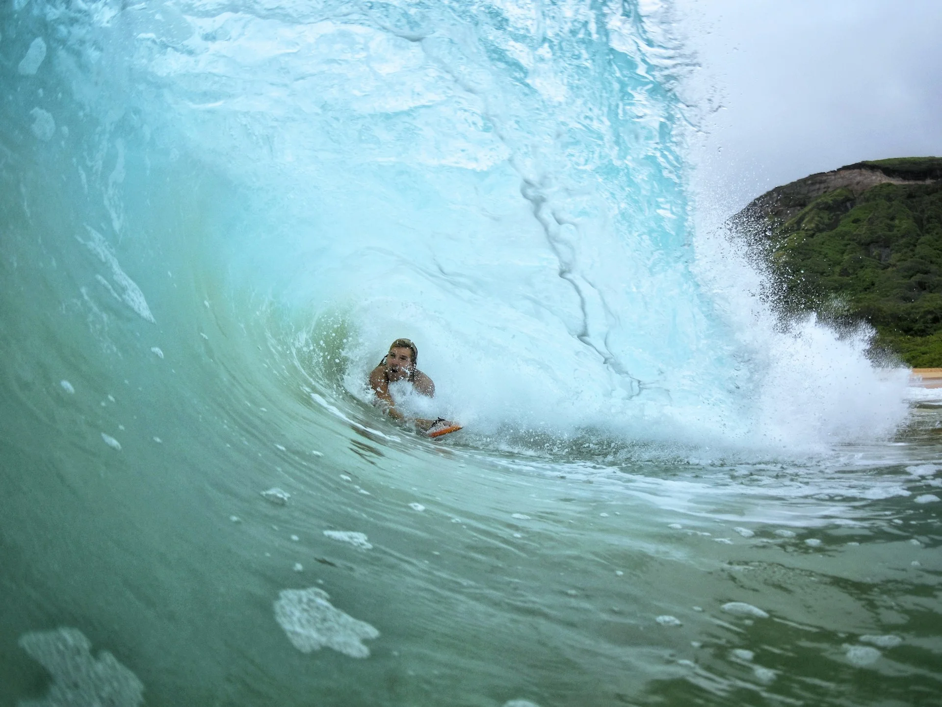 photo - man in a barrel surf session