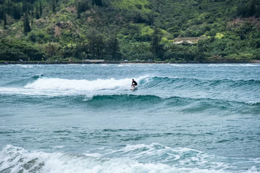 photo - a person dis learning how to how to surf step by step in the water