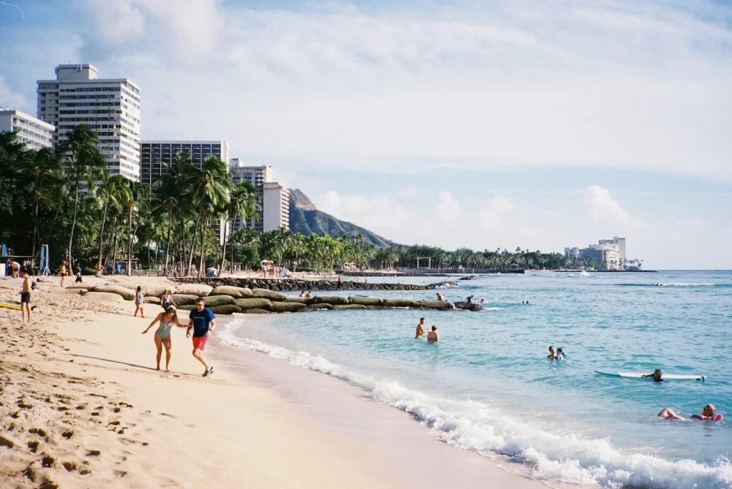 photo - tourists enjoying waikiki surf and swim in hawaii