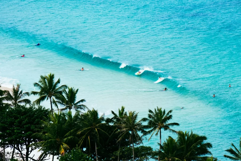 photo - people surfing at one of the top surfing spots oahu