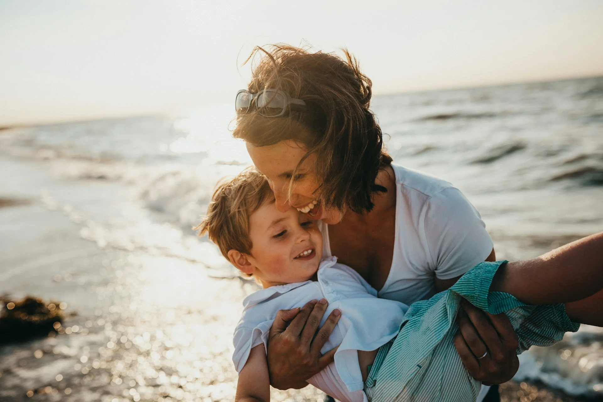 photo - a mother and her child about to do surf therapy for autism